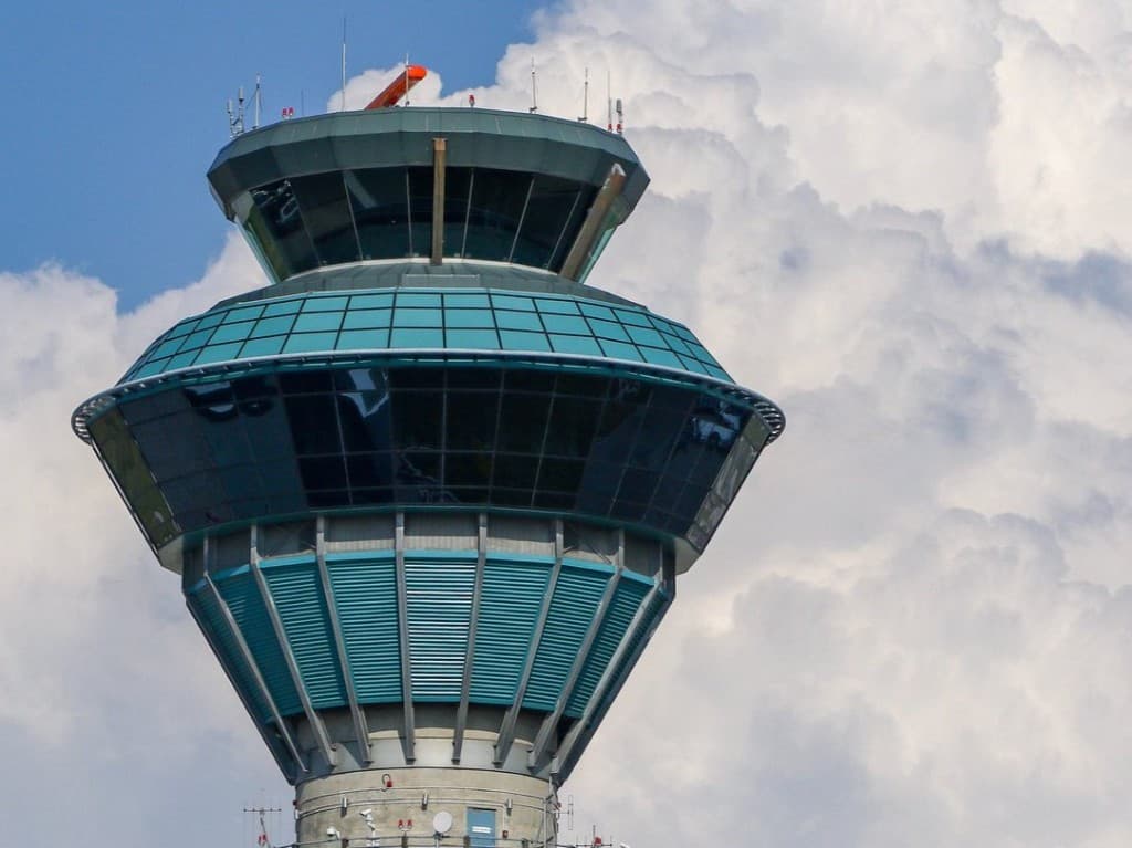 Modern Toronto Pearson International Airport control tower with Air Canada aircraft